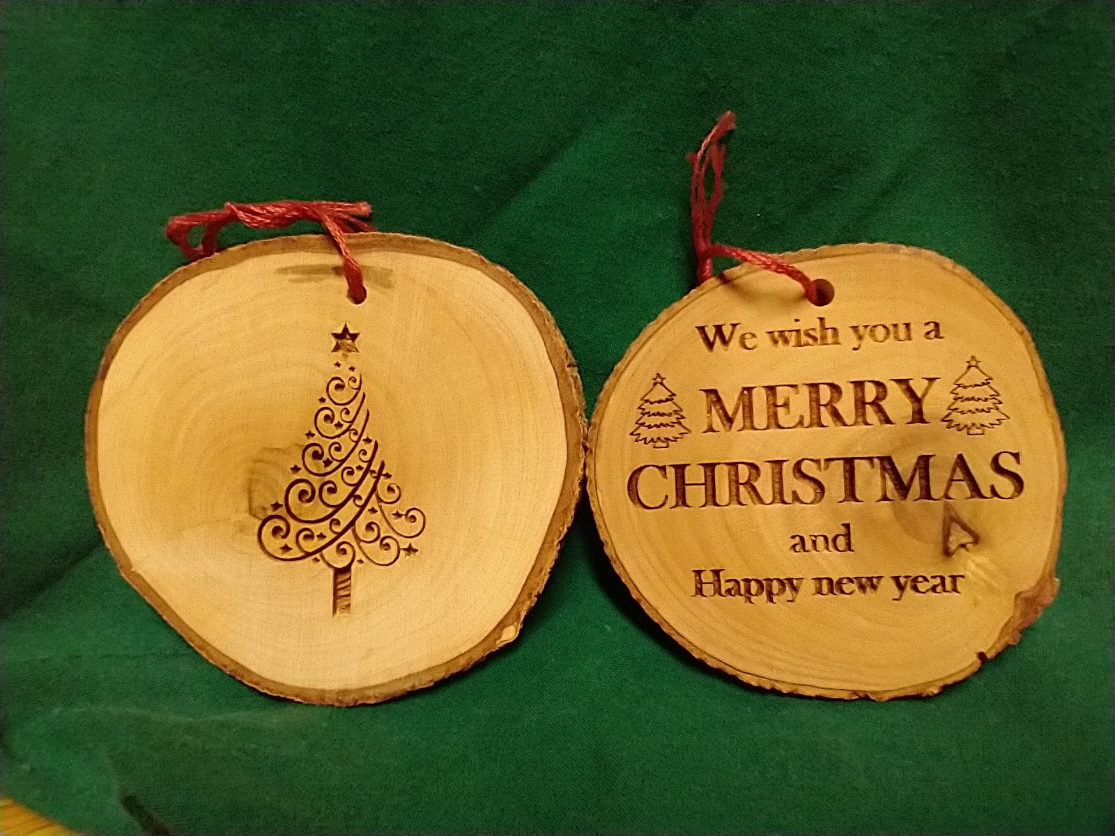 Wooden ornament, one side with tree and other side with Merry Christmas