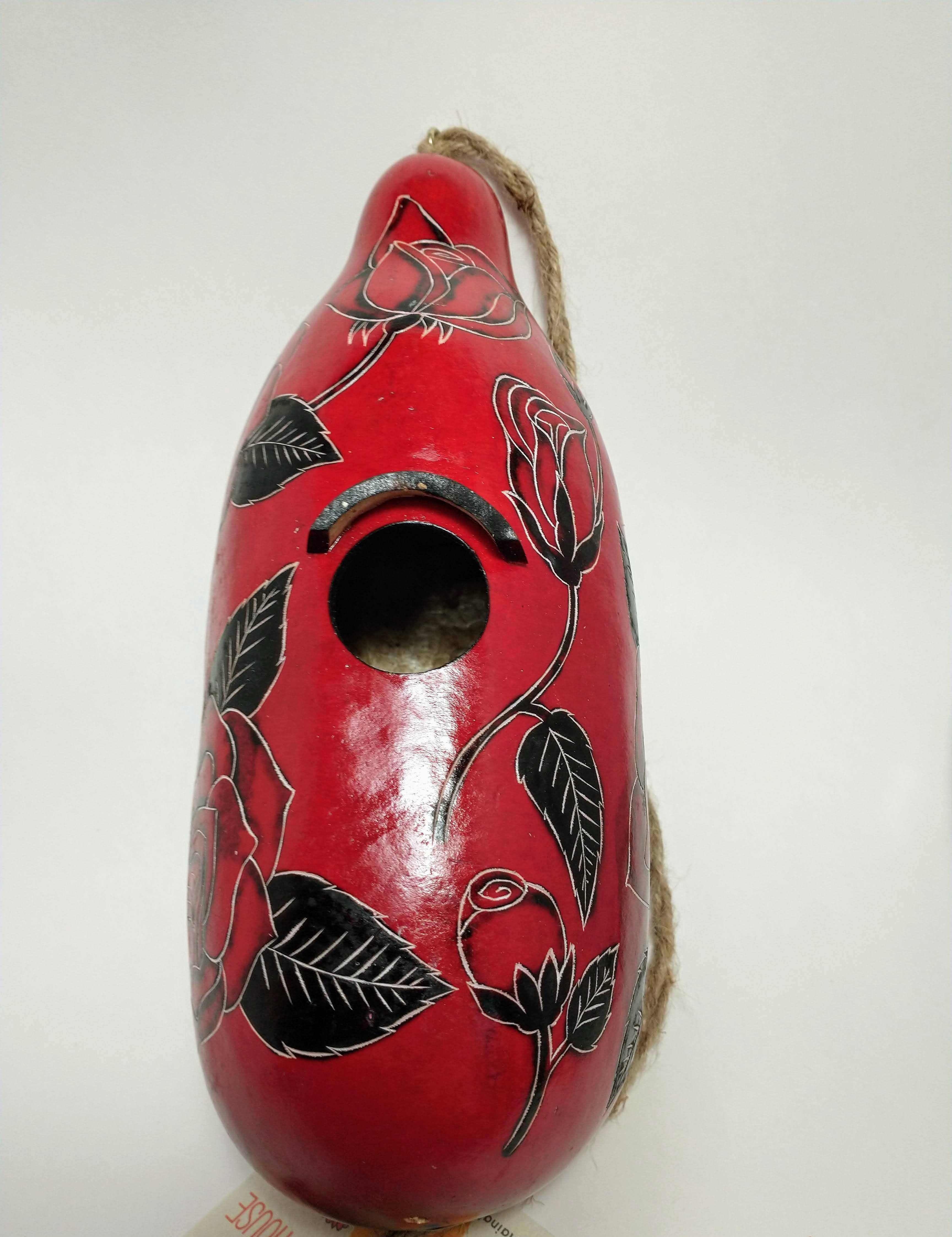 Red Cardinal birdhouse with green leaf design