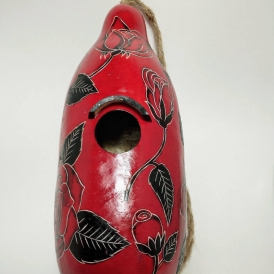 Red Cardinal birdhouse with green leaf design