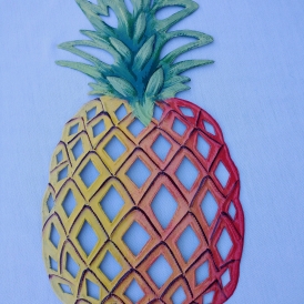 yellow, orange, and red with green top pineapple