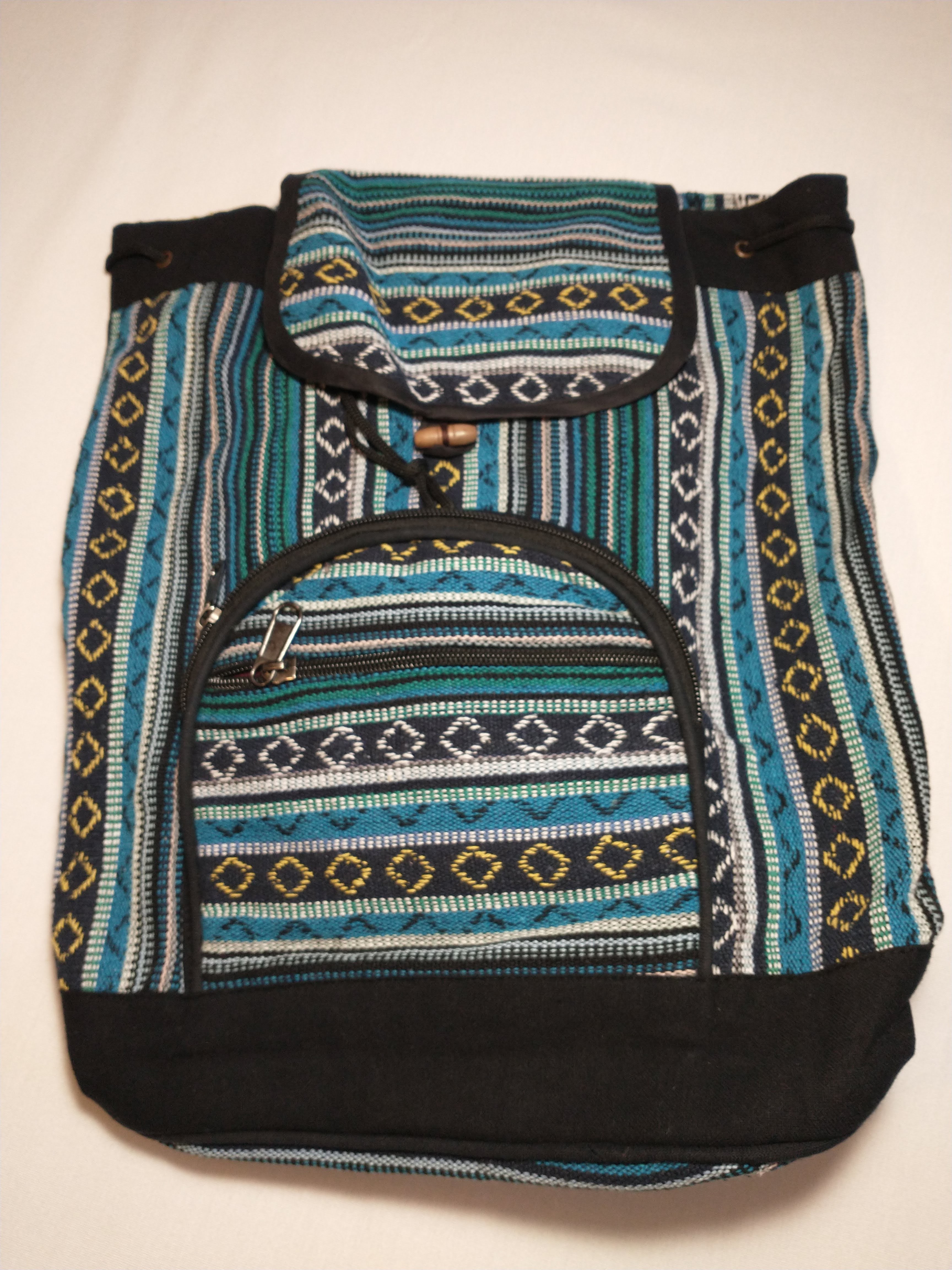 Green and blue patterned backpack